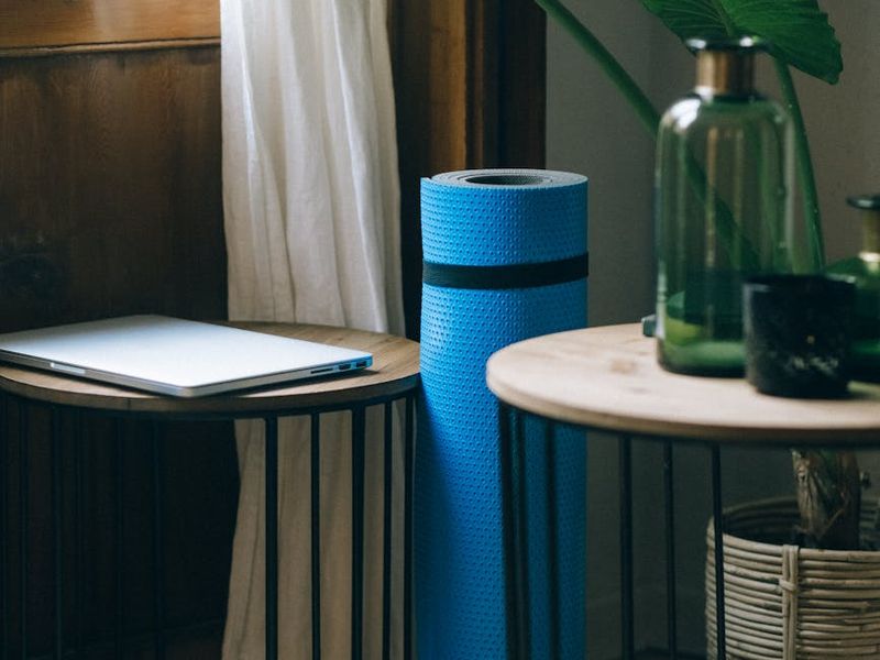 Spacious, sunlit room with a yoga mat on the floor.